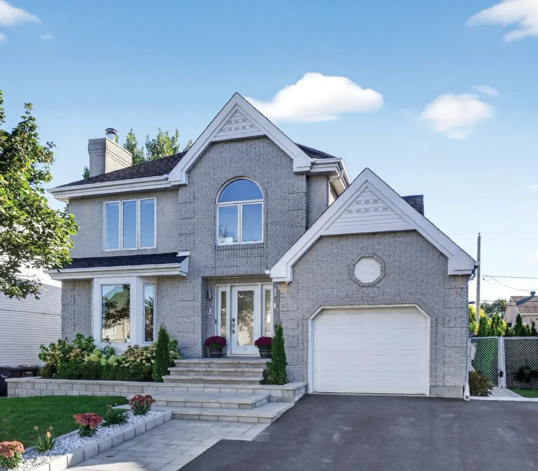 Cottage avec garage et aménagement paysager (photo à titre indicatif)